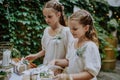 Little girls at outdoor wedding garden party. Royalty Free Stock Photo