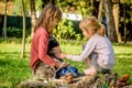 Little girls playing with husky puppy in the park Royalty Free Stock Photo