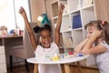 Little girls playing ludo board game