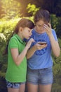 Little girls playing with phone