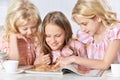 Little girls reading magazine Royalty Free Stock Photo