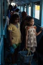 Little girls selling snacks on ferry boat