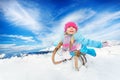 Little girls slide on sledge winter sunny day Royalty Free Stock Photo