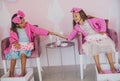 Little girls in spa center having treatment manicure and pedicure Royalty Free Stock Photo