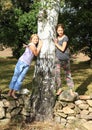 Little girls on stone wall Royalty Free Stock Photo