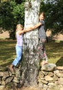 Little girls on stone wall Royalty Free Stock Photo