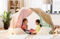 Little girls talking in kids tent at home Royalty Free Stock Photo
