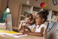 Little girls watching cartoons on laptop computer Royalty Free Stock Photo