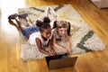 Little girls watching cartoons on a laptop computer Royalty Free Stock Photo