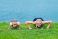 Little girt and woman are doing exercises