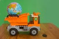 Little globe in garbage truck. Eco concept.