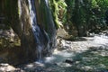 Little glorious waterfall among the rocks in mountain forest Royalty Free Stock Photo