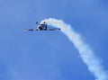 American Champion 8KCAB Decathlon aircraft stunt flying with smoke. Royalty Free Stock Photo