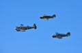 Fly past by 2 Spartan Executives and a Beech 3TM Model 18 Aircraft with blue sky background.