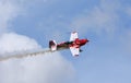 Global All Stars Extra 300S stunt aircraft in flight with smoke Royalty Free Stock Photo
