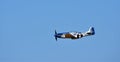 North American P-51D Mustang Aircraft `Miss Helen` flying with blue sky background.
