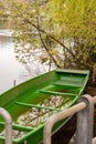 Little green boat in a lake in Werdenberg in Switzerland