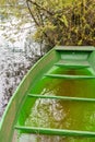 Little green boat in a lake in Werdenberg in Switzerland