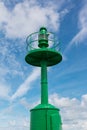 Little Green Metallic Lighthouse, Blue Sky and Clouds in Background Royalty Free Stock Photo