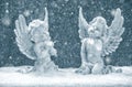 Little guardian angels in snow. christmas decoration Royalty Free Stock Photo