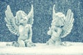 Little guardian angels in snow. christmas decoration