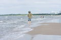 A little guy on the sandy beach.