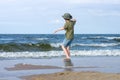 A little guy on the sandy beach.