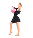 Little gymnast doing exercise with ball