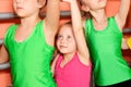 Little gymnasts doing exercise in gym