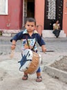 Little gypsy musician plays drum