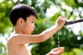 Little hand open for water drop from faucet Royalty Free Stock Photo