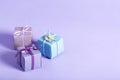 Little handmade present boxes on purple Royalty Free Stock Photo