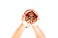 Little hands of child hold in the palm of wooden heart. Top view. Copy space, closeup. Royalty Free Stock Photo