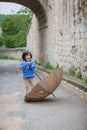 Little handsome baby boy playing with umbrella outdoor Royalty Free Stock Photo