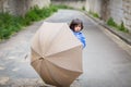 Little handsome baby boy playing with umbrella outdoor Royalty Free Stock Photo