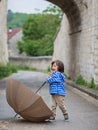 Little handsome baby boy playing with umbrella outdoor Royalty Free Stock Photo