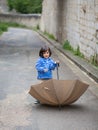 Little handsome baby boy playing with umbrella outdoor Royalty Free Stock Photo