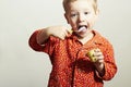 Little Handsome Boy eats Yogurt.Child with Spoon