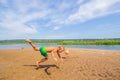 Little boy plays ball on the beach. Royalty Free Stock Photo