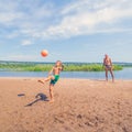 Little boy plays ball on the beach. Royalty Free Stock Photo