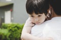 Little handsome Child hug Father during dad carry him and taking son go home after school Young boy get infect virus of flu, sick