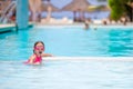 Little happy adorable girl swimming in outdoor pool Royalty Free Stock Photo