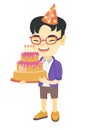 Asian child holding birthday cake with candles Royalty Free Stock Photo