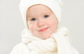 Little happy baby child girl in white hat in winter Royalty Free Stock Photo