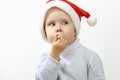 Little happy boy in cap of santa claus