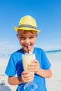 Little boy drinking cocktail on tropical beach Royalty Free Stock Photo