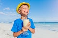 Little boy drinking cocktail on tropical beach Royalty Free Stock Photo