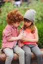 Happy boy and girl with coctail Royalty Free Stock Photo