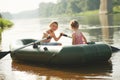 Happy boy swimming in fishing boat Royalty Free Stock Photo