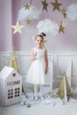 Little happy fairy or angel with magic wand on Holiday theme. Portrait of pretty caucasian little angel wearing white Royalty Free Stock Photo